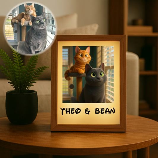 Cat mom gift idea shown as a lighted photo frame with an illustrated portrait of two cats named Theo and Bean beside their original photo