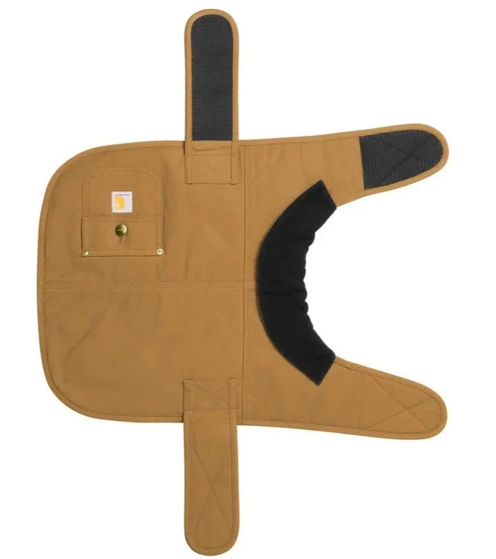 Tan Carhartt dog coat laid flat to show the quilted black lining, hook and loop neck and chest straps and the rivet-reinforced side pocket