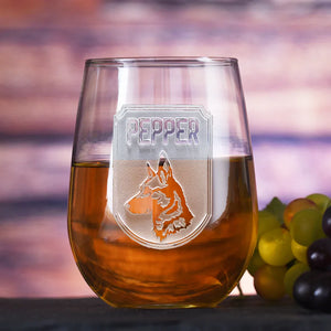 Personalized stemless wine glass featuring a deeply carved dog breed image and pet's name.