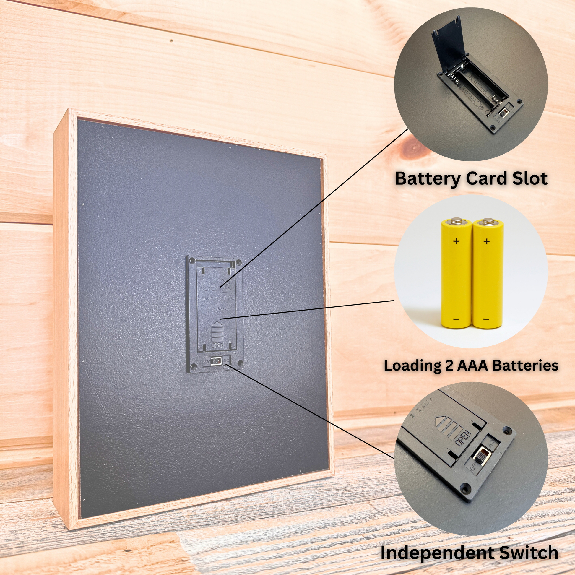 Wooden-framed light box back panel showing battery compartment with labeled diagrams of battery card slot, two AAA batteries, and independent switch