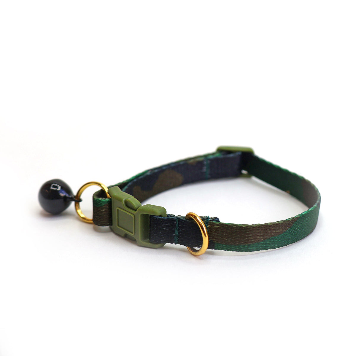 Green and black woven cat collar with olive plastic breakaway buckle, black bell with gold rings on white background