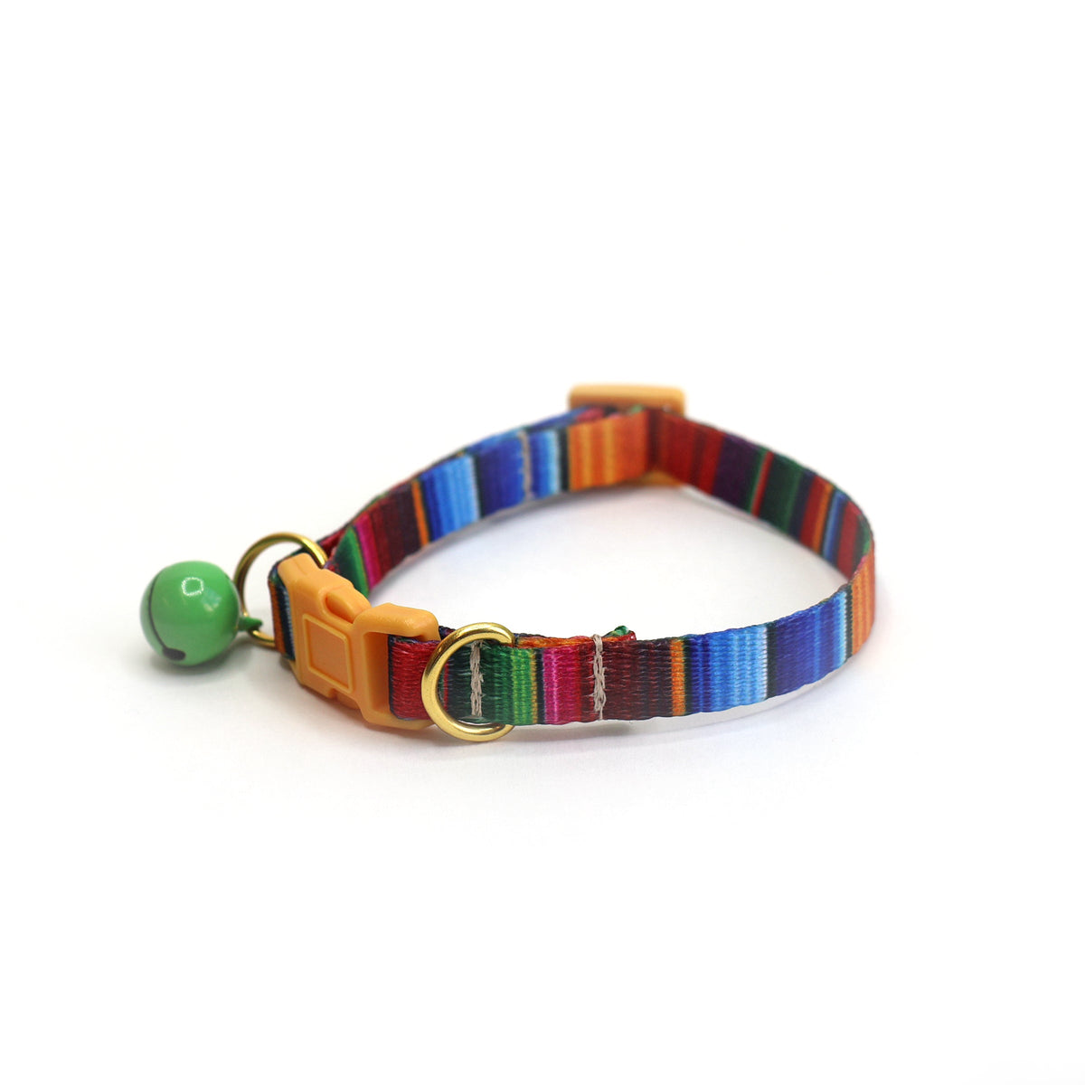 Bright rainbow striped cat collar with orange safety buckle, brass D-rings, and dangling green bell with small white paw print design