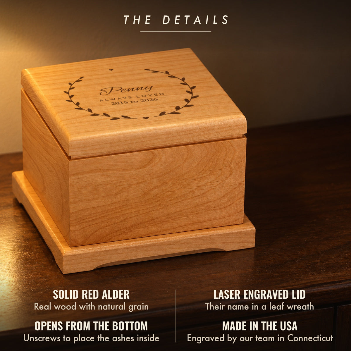 Details of the garden wreath pet urn: solid red alder, a laser engraved lid reading Penny, Always Loved, 2015 to 2026, opens from the bottom, made in the USA