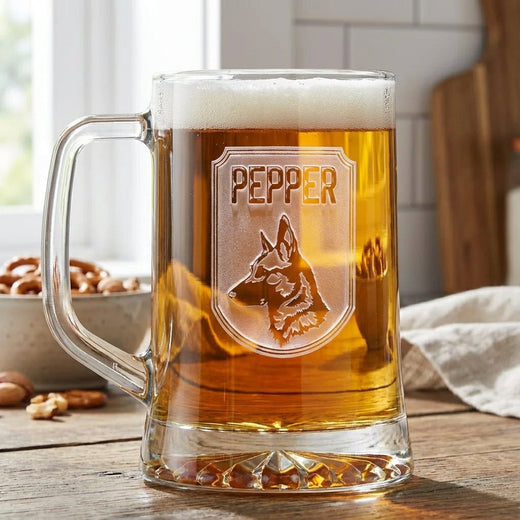 Top Dog personalized pub beer mug filled with beer, sand carved with a shield showing a German Shepherd silhouette and the name Pepper, on a wooden bar